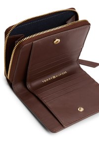 Brown leather wallet with gold zipper, multiple card slots, and an embossed logo. Interior features a dark fabric lining.