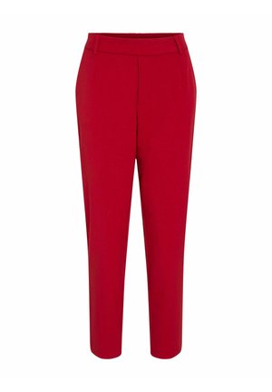 Pantalons rouges en tissu lisse avec un design ajusté, présentant une jambe fuselée et une taille plate avec un minimum de détails.
