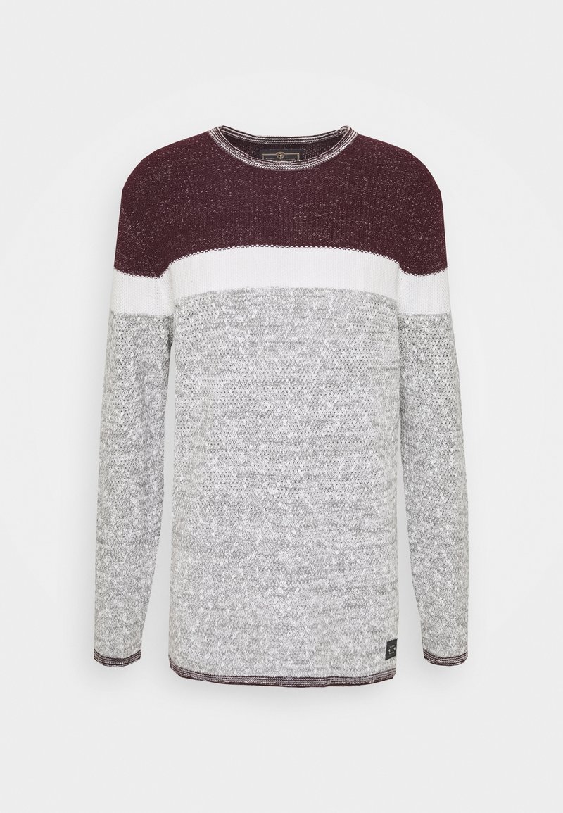 Maglione lavorato a maglia con una parte superiore color bordeaux, una striscia bianca al centro e una parte inferiore grigia. Maniche lunghe con polsini e orlo a coste. Tessuto testurizzato.