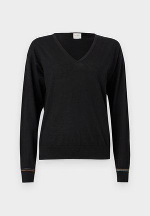 Černý pletený svetr s výstřihem do V, dlouhými rukávy a žebrovanými manžetami s barevným proužkem na lemu. Měkká textura.