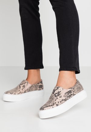 Slip-on sneakers feature a pink and black snake print design with a textured surface and a white platform sole.