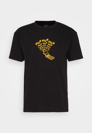 Sort bomulds t-shirt med gult grafisk tekst "HUF" og en retro fliptelefon illustration i midten, korte ærmer og rund hals.