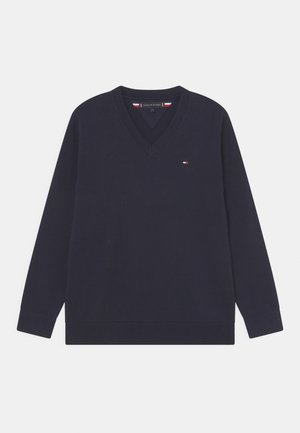 Marineblå V-hals langærmet sweater med lille Tommy Hilfiger flaglogo på venstre bryst og ribstrikkede manchetter og kant.