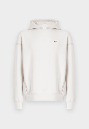 White hooded sweatshirt with a half-zip, featuring a subtle logo and contrasting side stripes. Made of smooth, textured fabric.