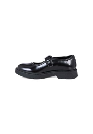 Chaussure Mary Jane en cuir verni noir avec un bout arrondi, une sangle au niveau de la cheville et une semelle en caoutchouc texturé. Finition lisse sans motifs visibles.