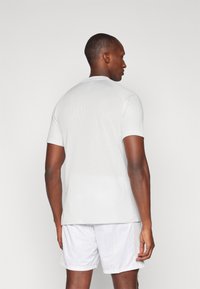 Nike Performance TOP - Camiseta deportiva - photon dust/dynamic turquoise