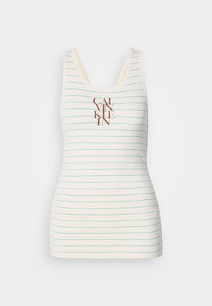 Äärtepuuduv tipp, millel on koorevärvi kangas ja sinised horisontaalsed triibud, ning keskel pruun "CALVIN KLEIN" logo. Sile tekstuur.