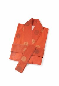 Orange kimono with circular patterns, featuring gold and dark accents. The fabric is smooth, folded neatly with a matching belt.