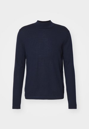 Suéter de gola alta de manga longa azul marinho, feito de um material suave e leve. Apresenta um design ajustado com costuras mínimas e uma textura lisa.