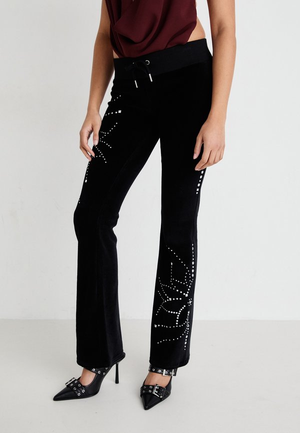 LOW RISE JOGGERS WITH STUD ARTWORK - Trousers