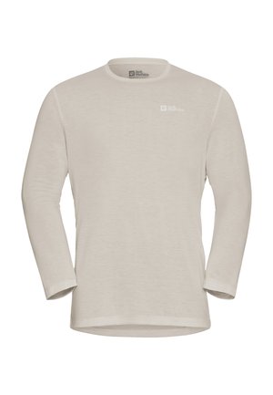 T-shirt beige à manches longues, col rond, avec le logo Jack Wolfskin sur la poitrine gauche et à l'intérieur du col, fabriqué en tissu léger.