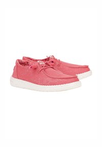 Rosa Stoffschuhe mit weiß gepunkteten Sohlen. Sie verfügen über ein niedriges Design, ein Schnürsystem und ein gemustertes Innenfutter. Glatte Textur.