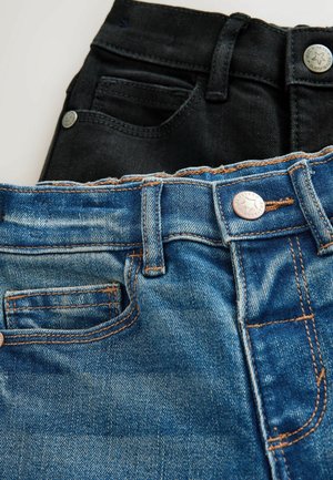 Denim jeans in two colors: black and blue. The blue pair features a faded texture with orange stitching; both have metal buttons and pockets.