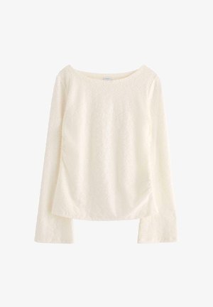 Leinen Langarmshirt in Off-White mit einem strukturierten Blumenmuster, weitem Ausschnitt und gerafftem Seitendetail. Glattes, weiches Material.