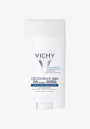 White cylindrical deodorant stick with a twist-up mechanism, labeled “Vichy,” featuring blue text and hypoallergenic details.