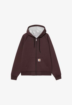 Felpa con zip marrone con interno grigio. Presenta una tasca a marsupio e una patch con logo sulla parte anteriore. Realizzata in tessuto morbido e testurizzato.