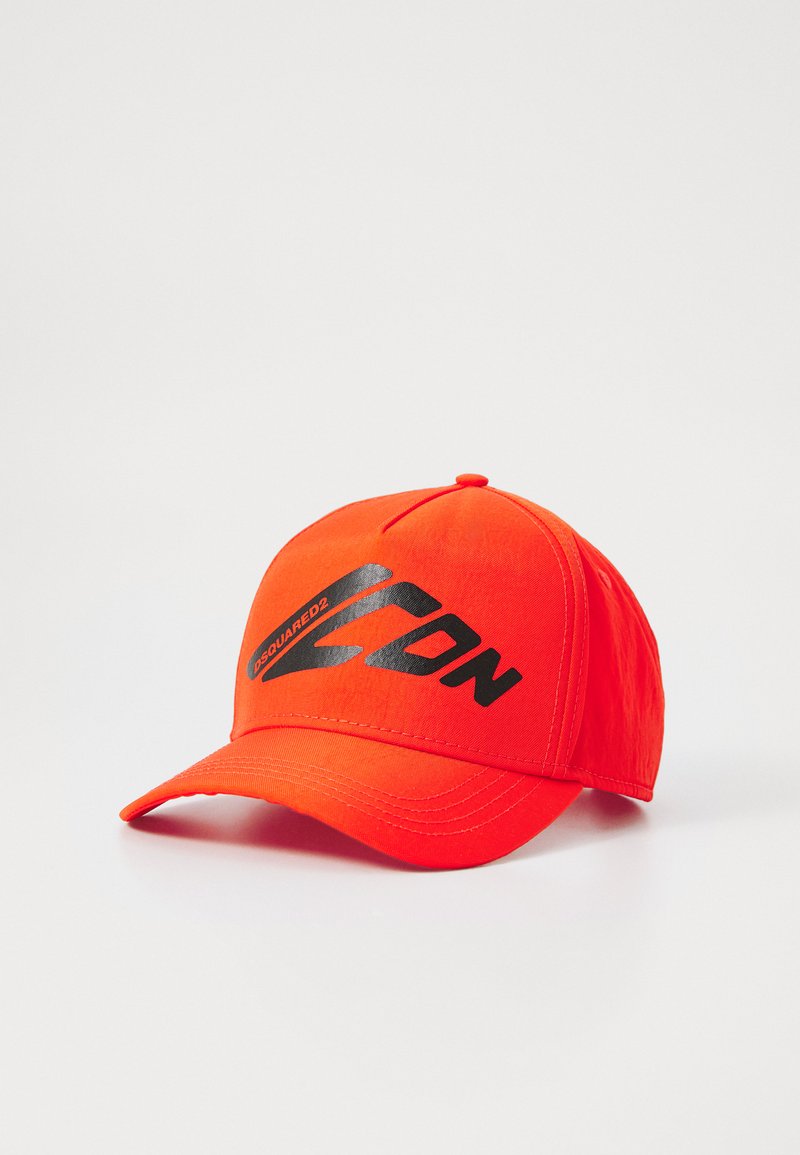 Red baseball cap with a curved brim, featuring a black logo and text on the front. Made of fabric with smooth texture.