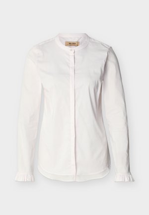White long-sleeve blouse with band collar, concealed button placket, subtle vertical stripes, and ruffled cuffs, displayed on a plain background.
