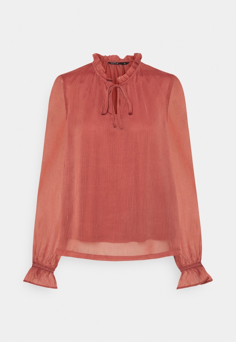 Blouse transparente à manches longues couleur rouille avec col à volants, fermeture à nouer au cou et poignets élastiques à volants.