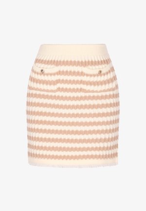 Knit mini skirt featuring alternating beige and white stripes, ribbed waistband, two front pockets with button accents, and fringe hem.
