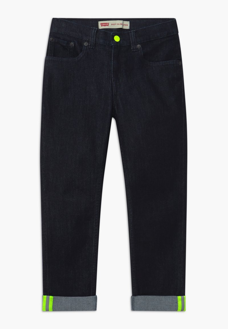 Dark blue denim jeans with a slim fit, featuring a neon green accent at the rolled cuffs, contrasting stitching, and front pockets.