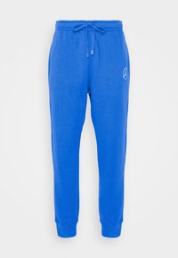 Pantalon de jogging bleu vif avec taille élastique et cordon de serrage, chevilles retroussées, et petit logo circulaire sur la cuisse droite.