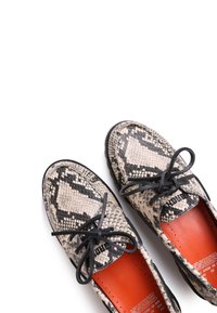 Snake-print shoes featuring a textured pattern, black laces, and an orange insole. The soles are black with a rounded shape.