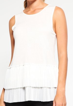 White sleeveless top featuring a smooth upper section and a pleated lower hem, creating a layered effect with soft texture.