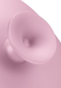 Ventosa in silicone di un morbido rosa, con un design arrotondato, centro testurizzato e bordi lisci, montata su una superficie simile.