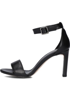 Sandale à talons hauts en cuir noir avec sangle de cheville ajustable, bout ouvert et texture lisse. Présente un design épuré et minimaliste.