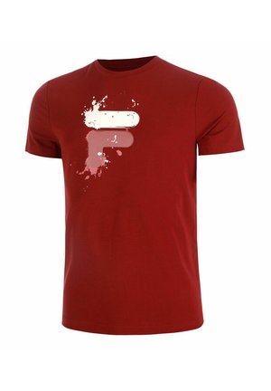 T-shirt rossa in cotone con un audace design grafico bianco e rosa con accenti splatter sul lato superiore sinistro. Maniche corte e collo rotondo.
