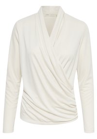 Långärmad, krämfärgad omslagsblus med V-ringning och rynkdetalj på ena sidan vid midjan.