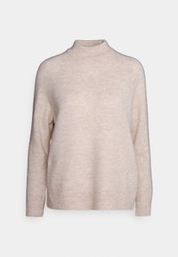 Ljusbeige polotröja i mjukt, texturerat tyg. Har långa ärmar samt ribbade avslut vid fåll och ärmslut, vilket ger en mysig siluett.