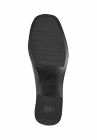 Suola di scarpa nera con superficie testurizzata, caratterizzata da un design rigato e tacco piatto. Le marcature includono dettagli sul marchio e sulla taglia.