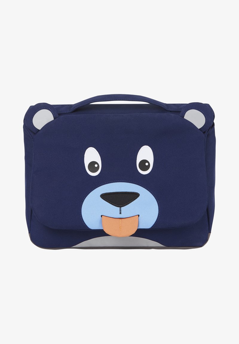 Sac bleu marine avec un motif de visage d'ours. Présente de grands yeux, un museau bleu et une langue orange. Comprend une poignée supérieure et une texture en tissu doux.