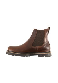 Botín Chelsea de cuero marrón con paneles elásticos en los costados, puntera redondeada y suela negra robusta. Presenta la marca Birkenstock en el lateral.
