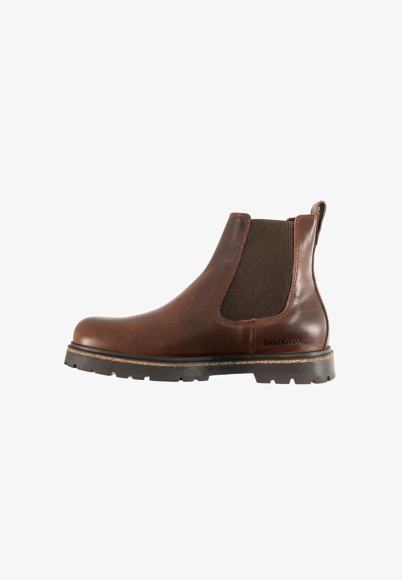 Stivale Chelsea in pelle marrone con pannelli laterali in elastico, punta arrotondata e suola robusta nera. Presenta il marchio Birkenstock sul lato.