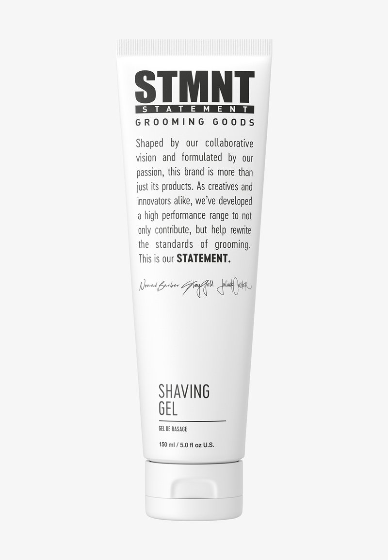 Tube blanc pour gel de rasage, étiqueté "STMTNT", avec texte noir minimaliste. Contient 150 ml de gel, texture lisse, design simple.