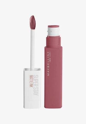 Rouge à lèvres liquide Maybelline Super Stay Matte Ink dans une teinte mauve discrète, avec un applicateur blanc et une pointe en mousse pointue pour une application précise.