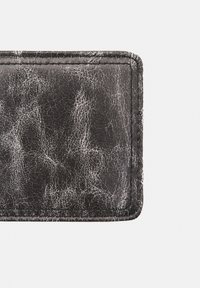 Black textured cardholder made of leather with a cracked finish. Features clean stitching and rounded edges. Small, rectangular design.