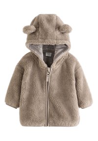 Veste en polaire beige avec capuche ornée d'oreilles, fermeture éclair et doublure intérieure douce avec un motif.