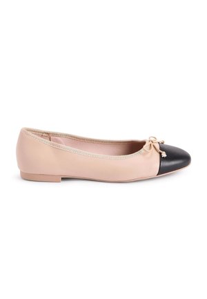 Beige flat ballet shoe with black rounded toe and small decorative bow on white background.