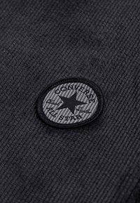 Converse Nadrágok - dark matter