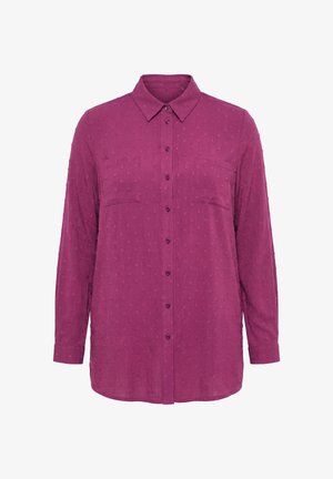 Blouse violet à manches longues avec boutons, motif à pois texturé, deux poches poitrine, col classique et poignets boutonnés.