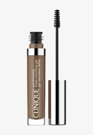 Gel volumisant teinté de Clinique dans un tube transparent avec des accents argentés. Comprend un pinceau applicateur noir, couleur : brun moyen.