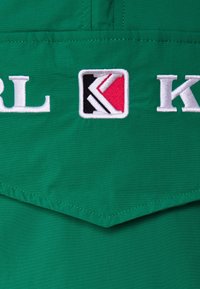 Karl Kani Vindjacka - turquoise