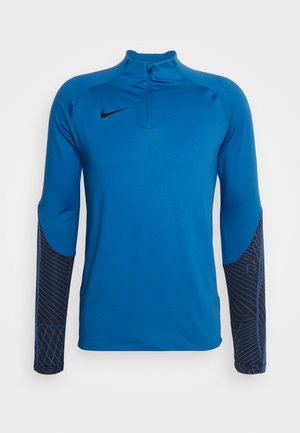 Langarm sporttop in levendig blauw, met een kwart ritssluiting en contrasterende zwarte gemusterde mouwen met een gladde textuur. Nike-logo aanwezig.