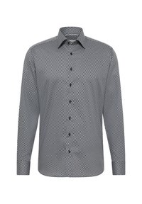 Chemise à manches longues avec un motif géométrique en diamants noir et blanc et un col pointu.