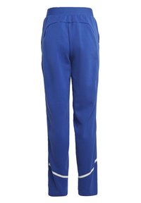 Pantalons de jogging bleus avec taille élastique, poches latérales et rayures réfléchissantes blanches près des jambes inférieures.