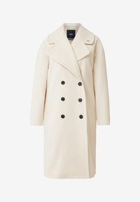 Dubbelknäppt kappa i mjukt krämfärgat tyg, med en stor krage, svarta knappar och avslappnad passform med långa ärmar.